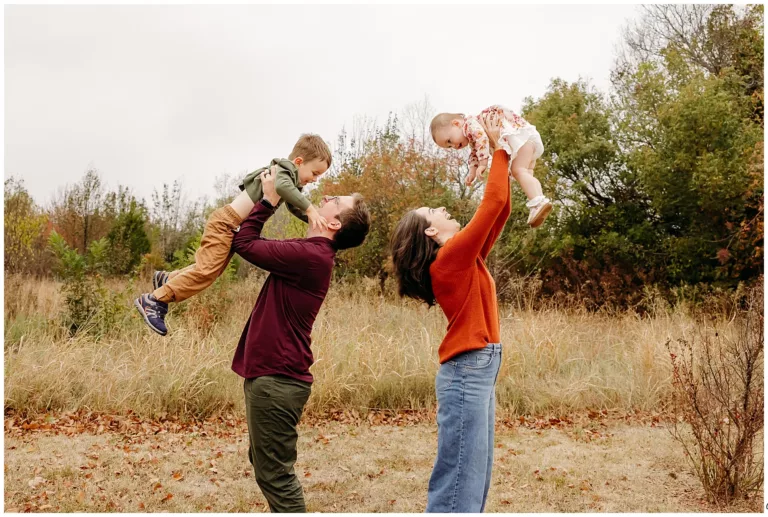 family of four in fall field in Edmond, OK for a mini session.
