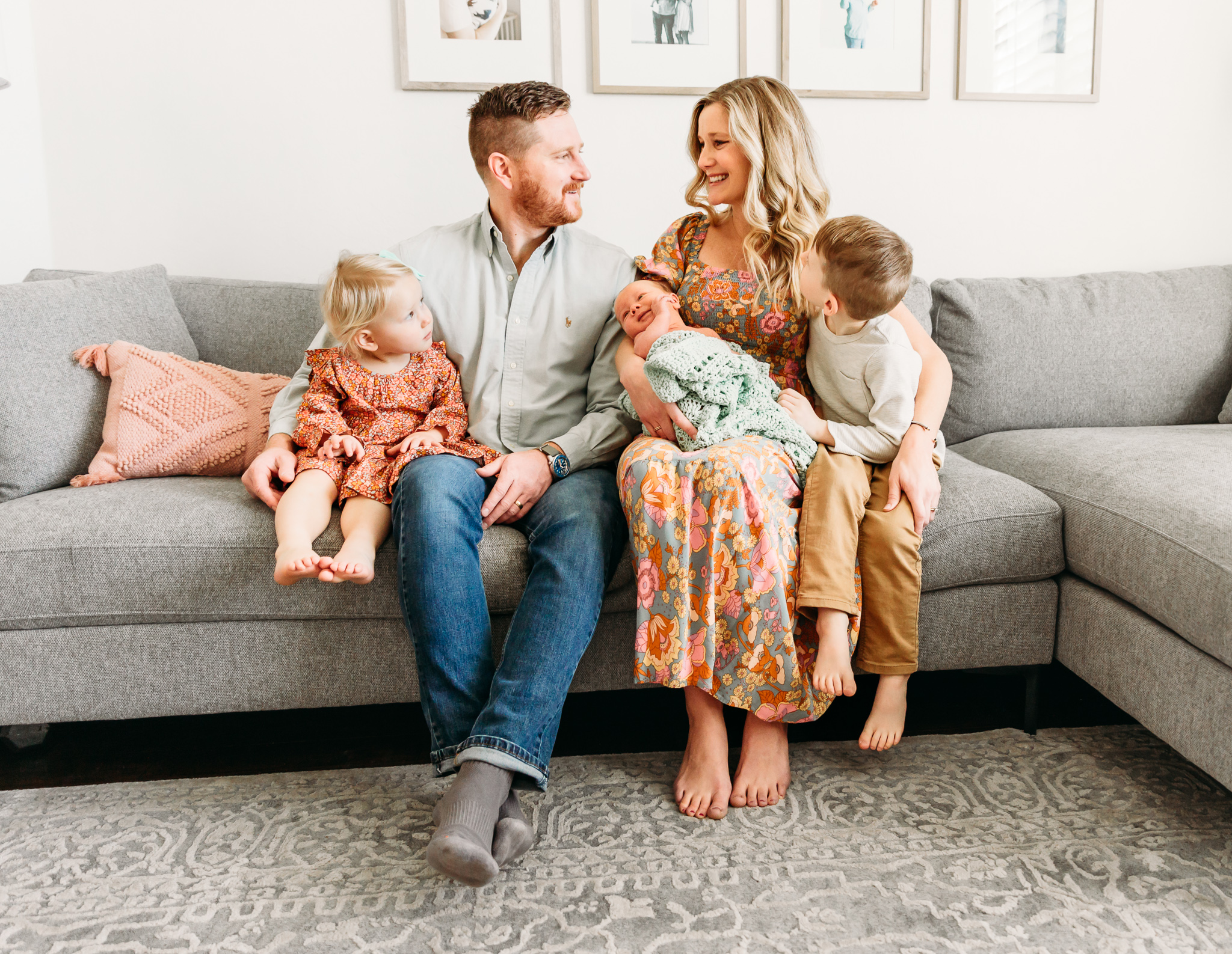 Picture of family of five on a couch.