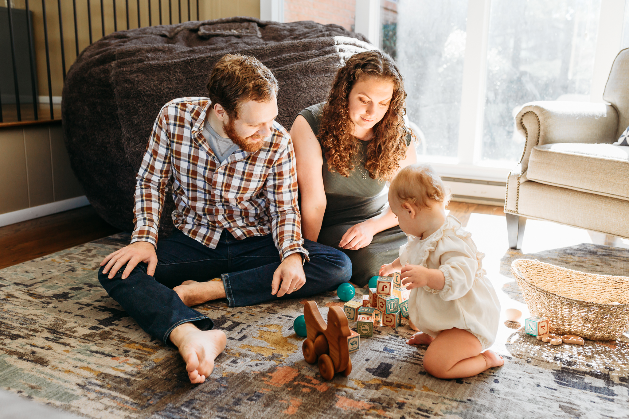 A family plays together in their living room.