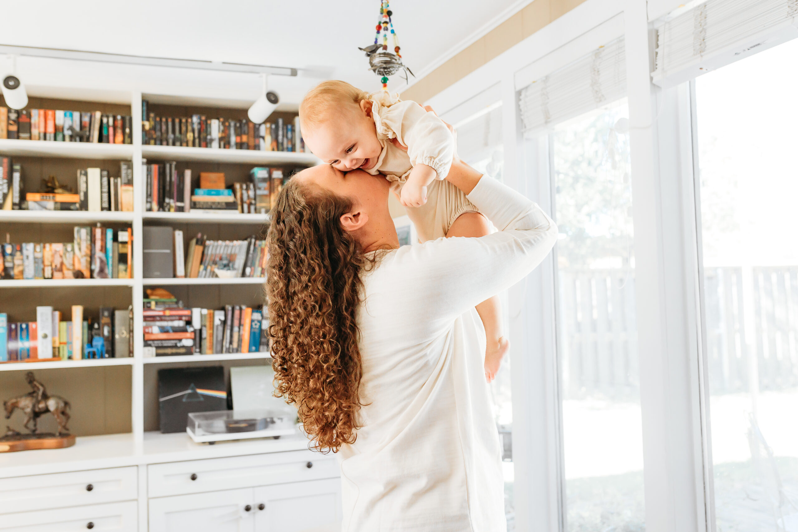 A mom holds her child.
