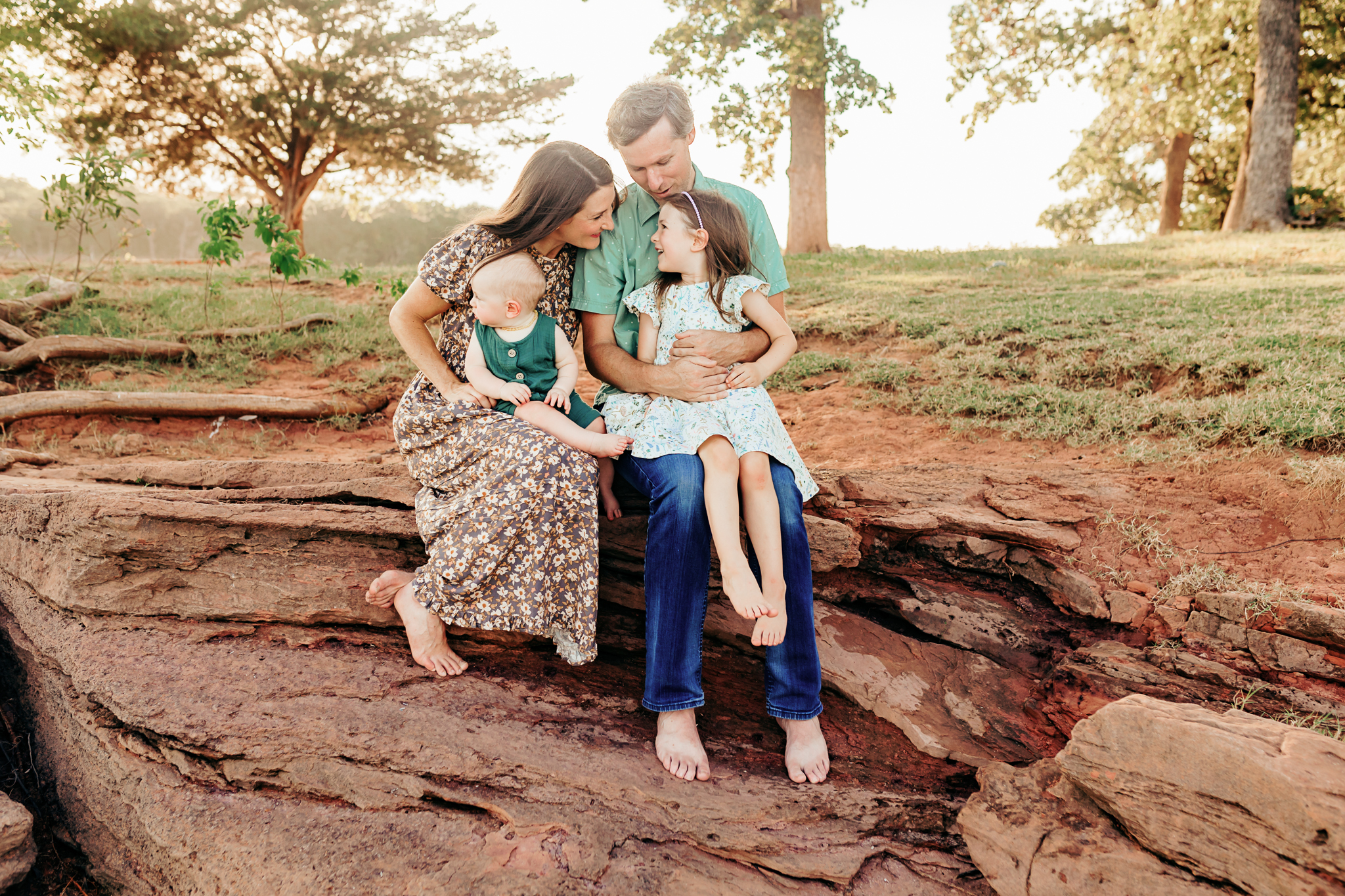 Mother and daughter sit together at Lake Arcadia.