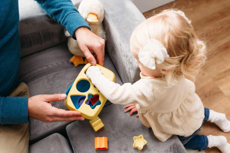 toddler plays with toys