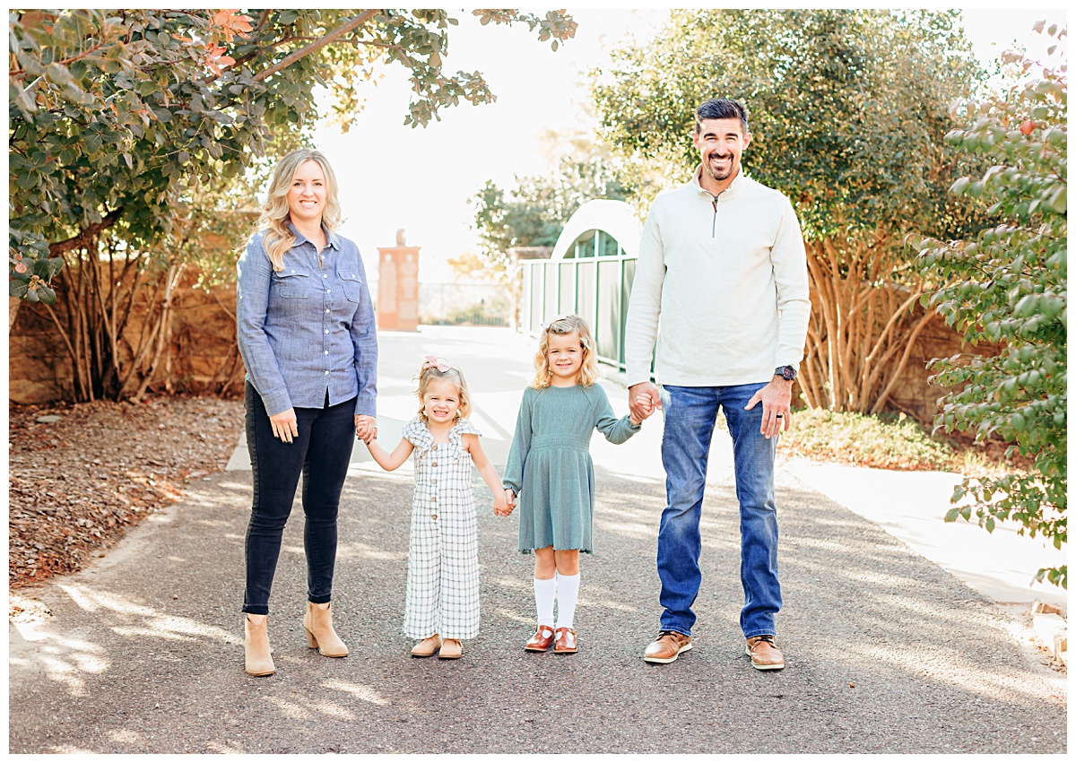a mom and dad hold newborn during photo session