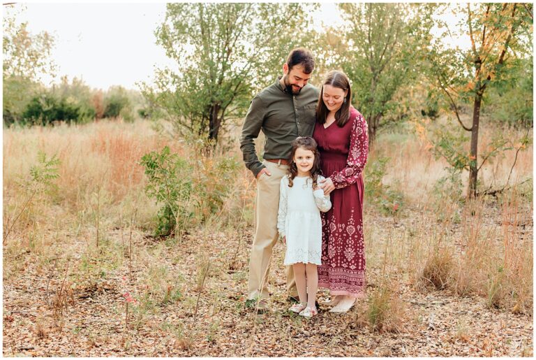 Family of 3 at Lake Hefner, OK during family photo session.