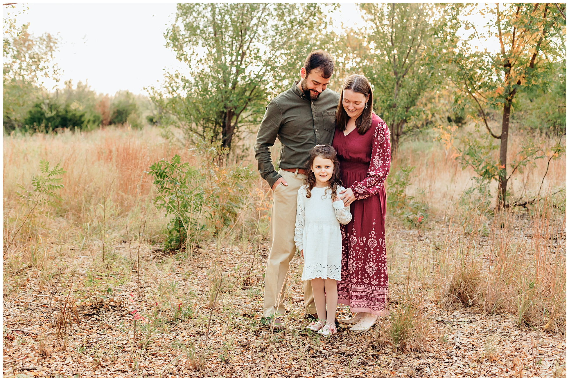 Family of 3 at Lake Hefner, OK during family photo session.