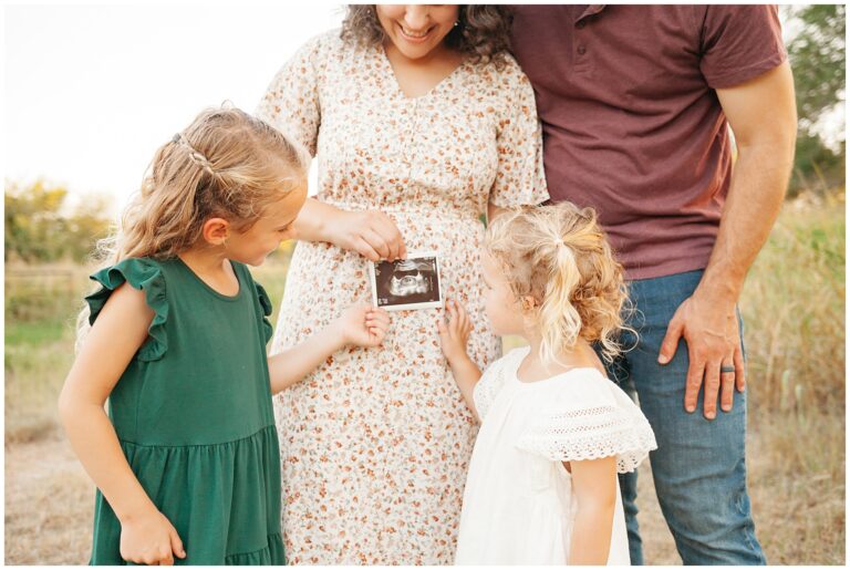 A family of four with ultrasound picture.
