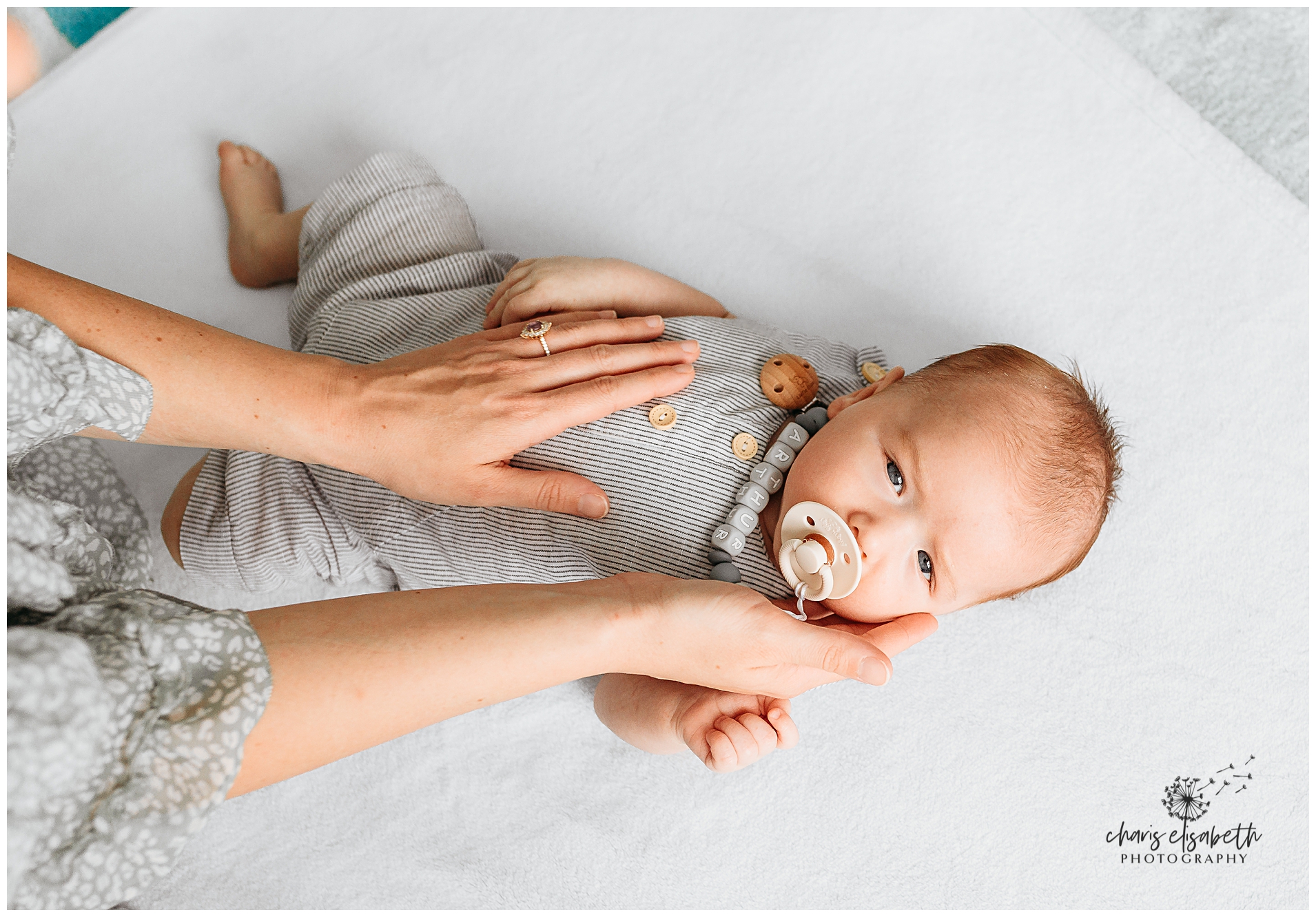 Mother and daughter sit together at Lake Arcadia.