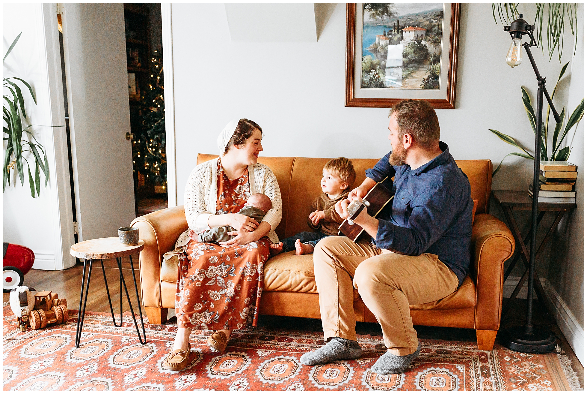 a mom and dad hold newborn during photo session