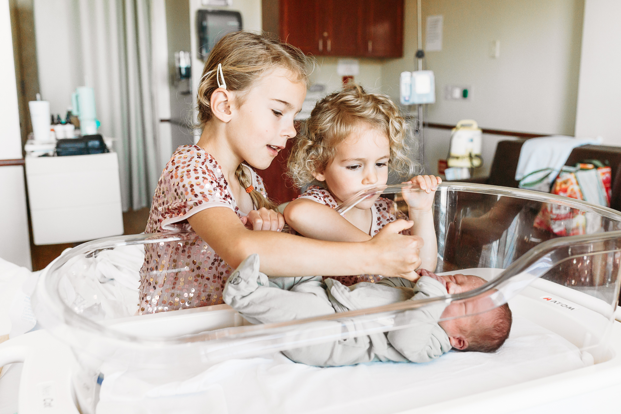 Family during in living room with toddler playing on floor