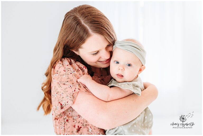 Mom snuggles baby at Ren Space Studio.