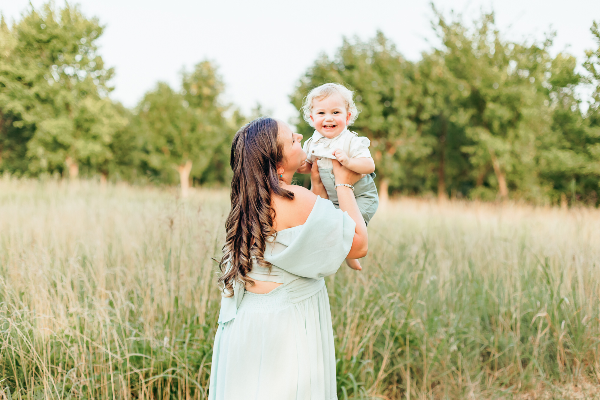 mom, dad, toddler and newborn during lifestyle photo session.
