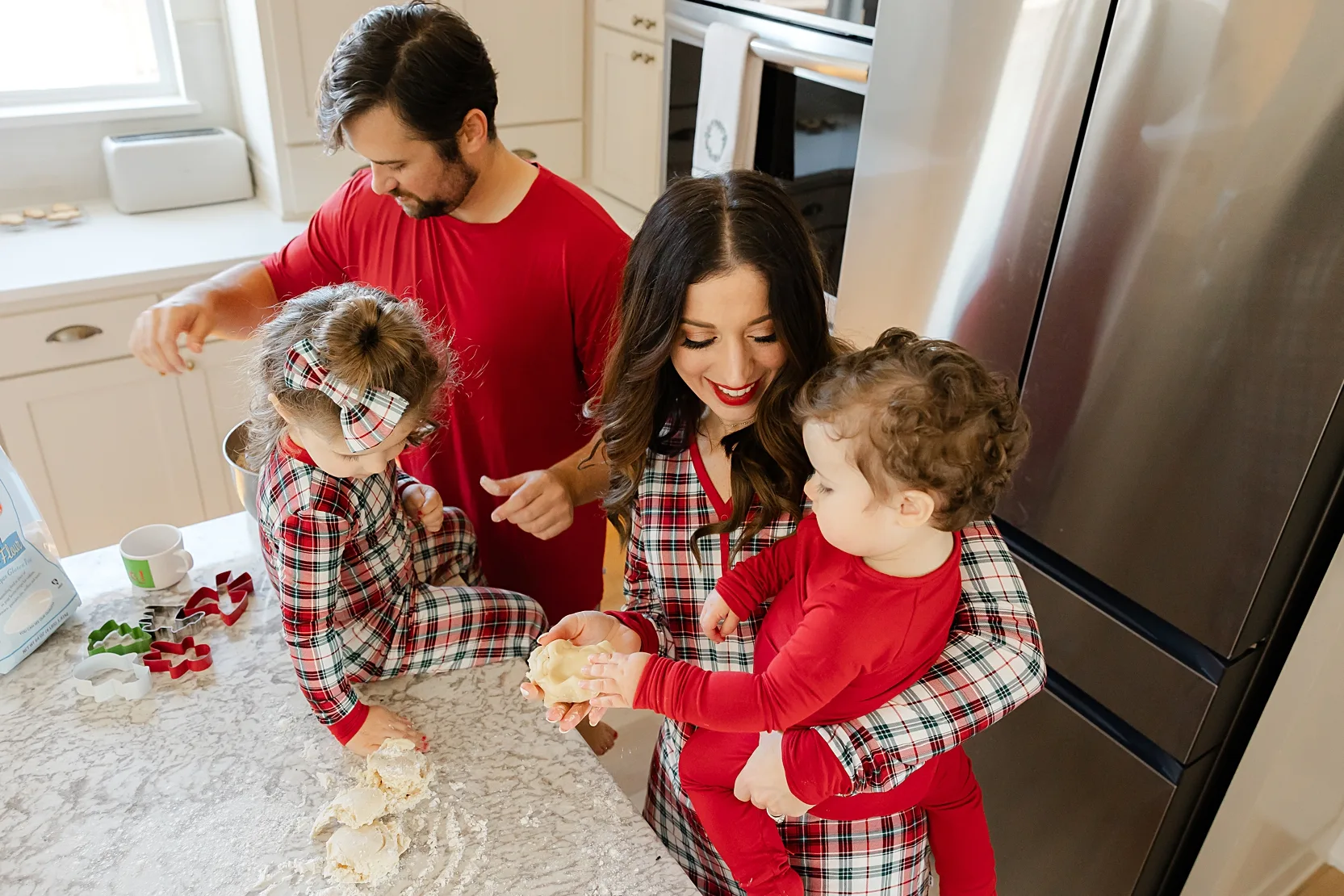 Family of 3 making cookies.