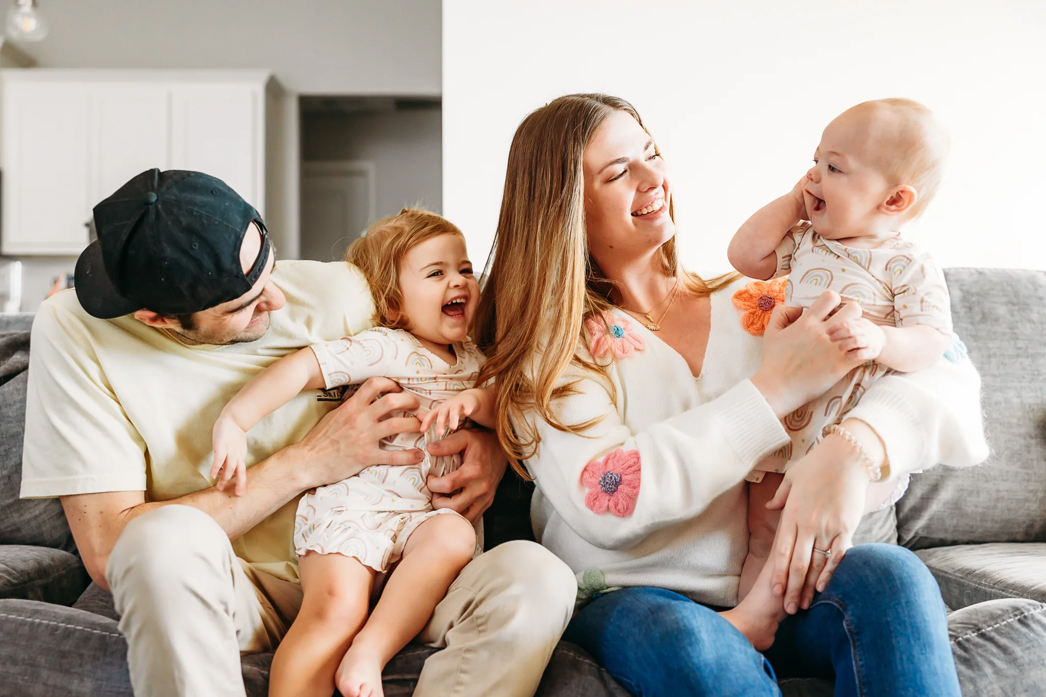 Mom and Dad kiss during family photo session.