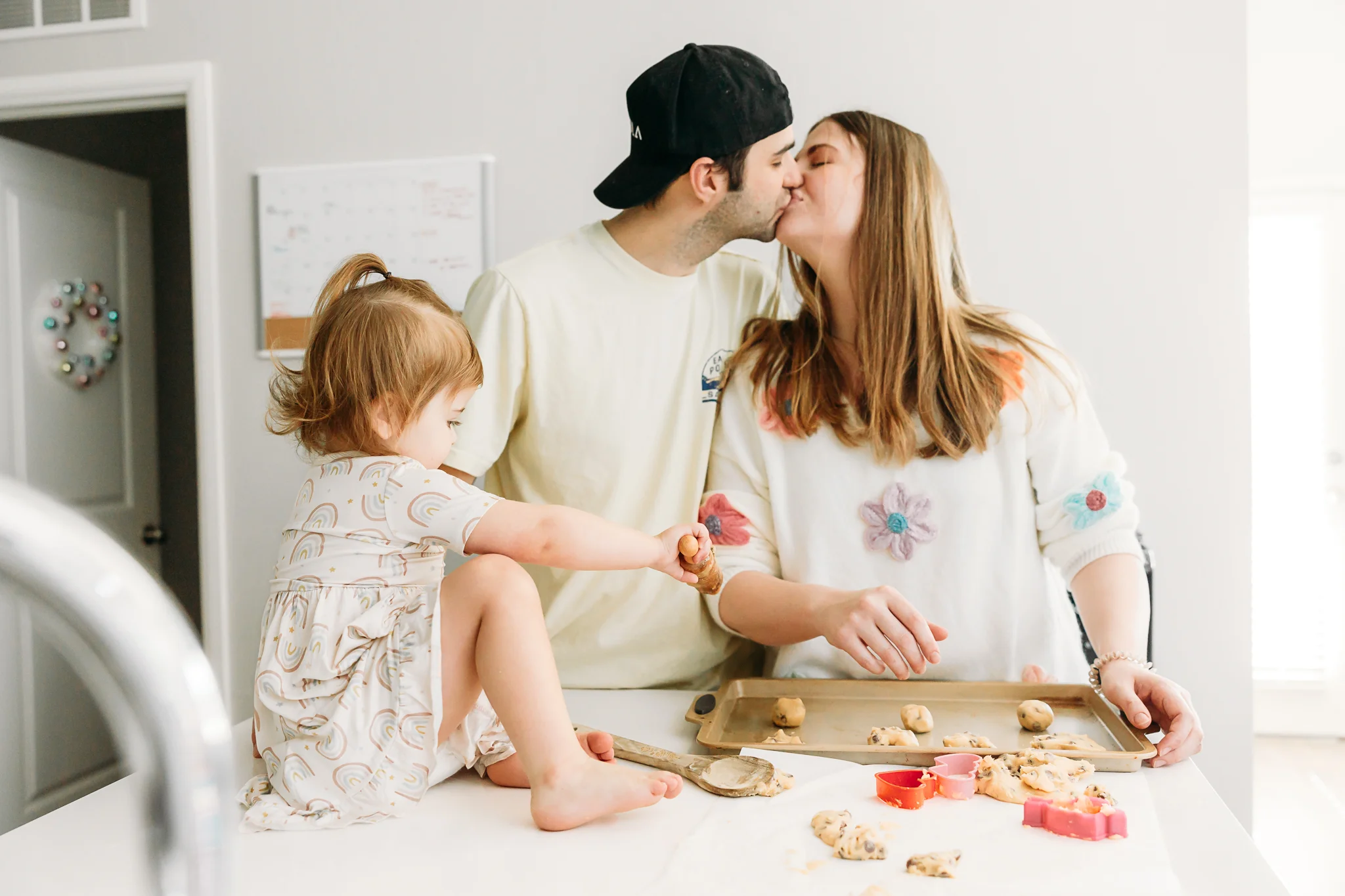 Family makes cookies together during at home photo session in OKC.