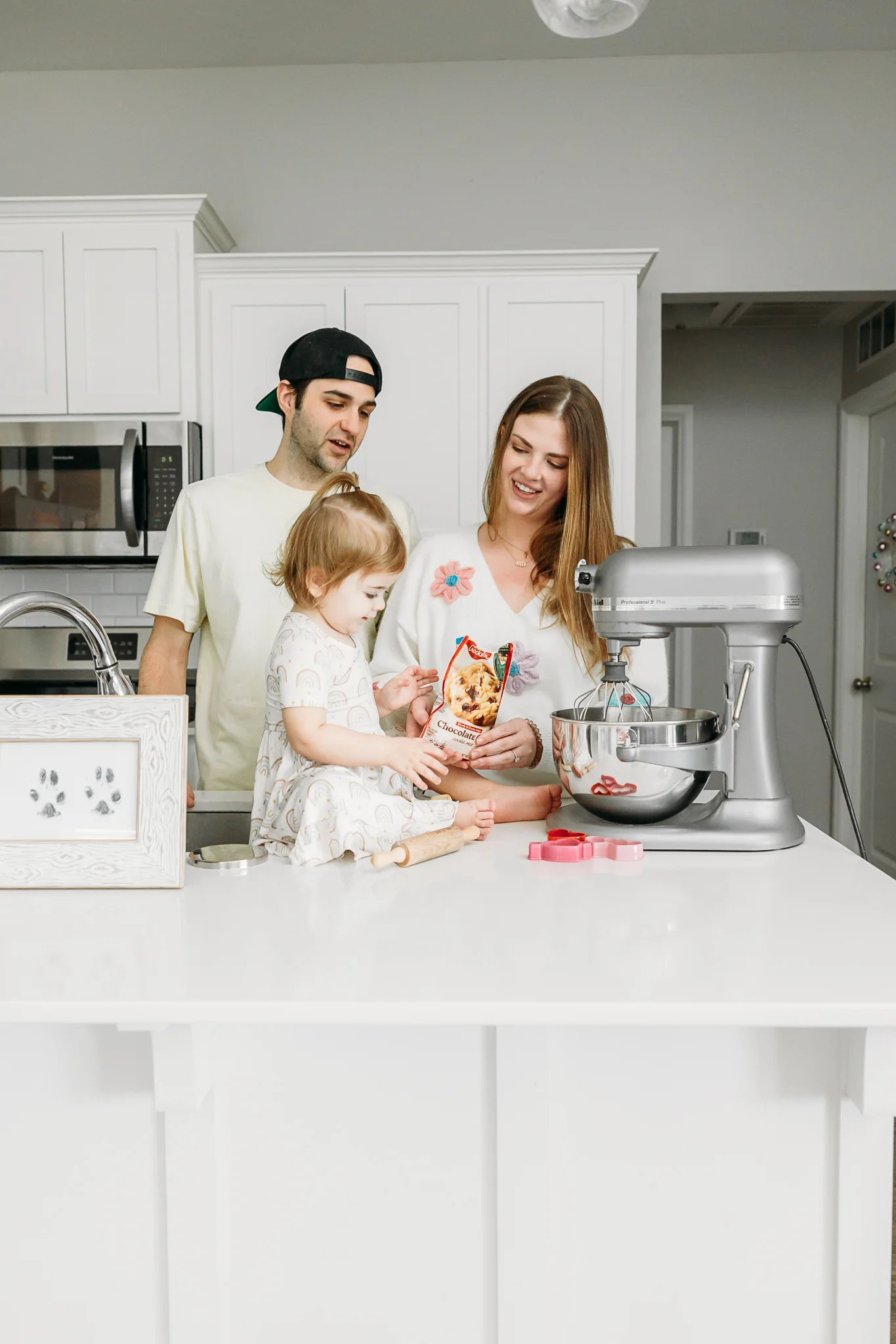 Family makes cookies together during at home photo session in OKC.