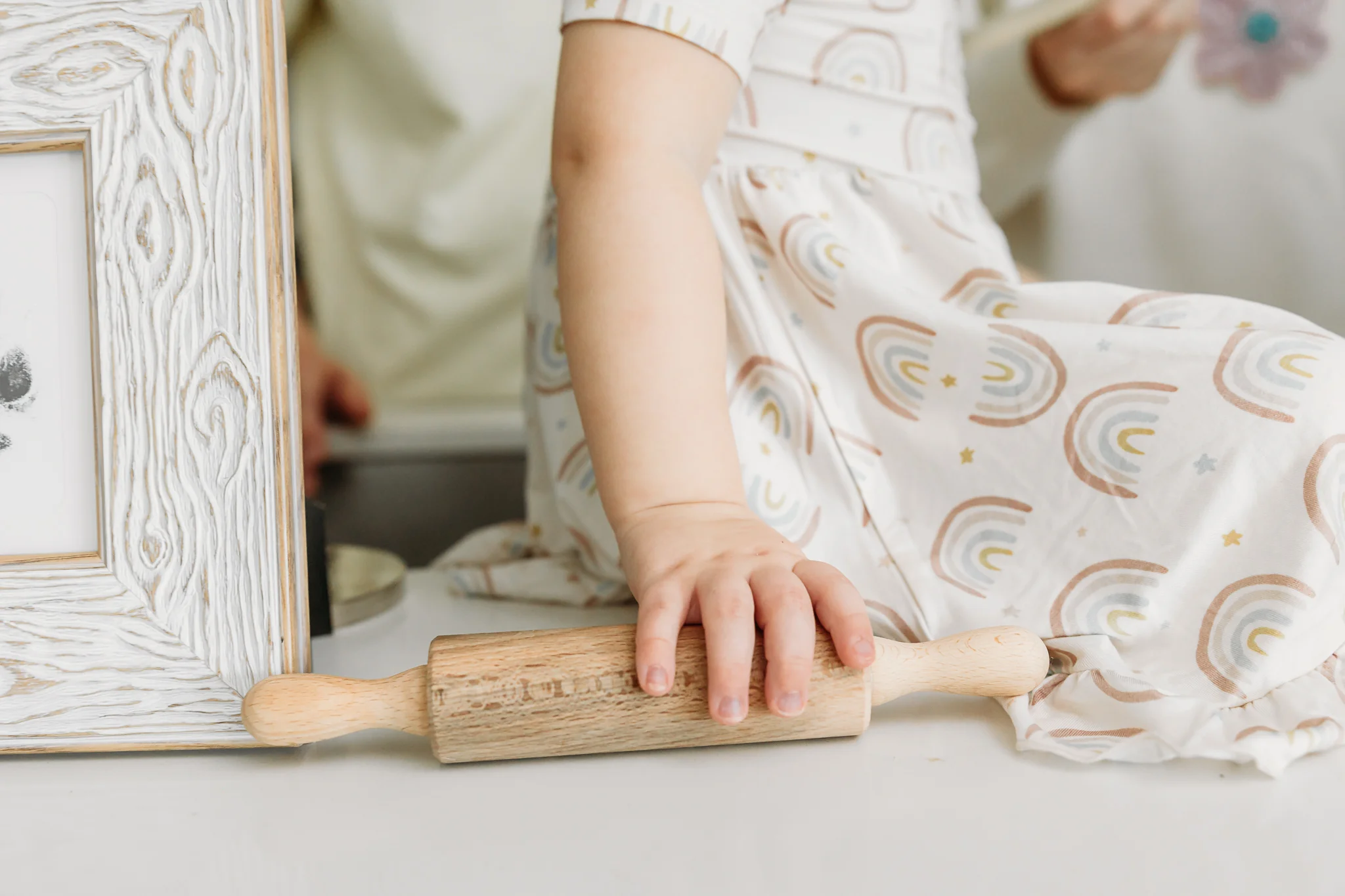 Family makes cookies together during at home photo session in OKC.