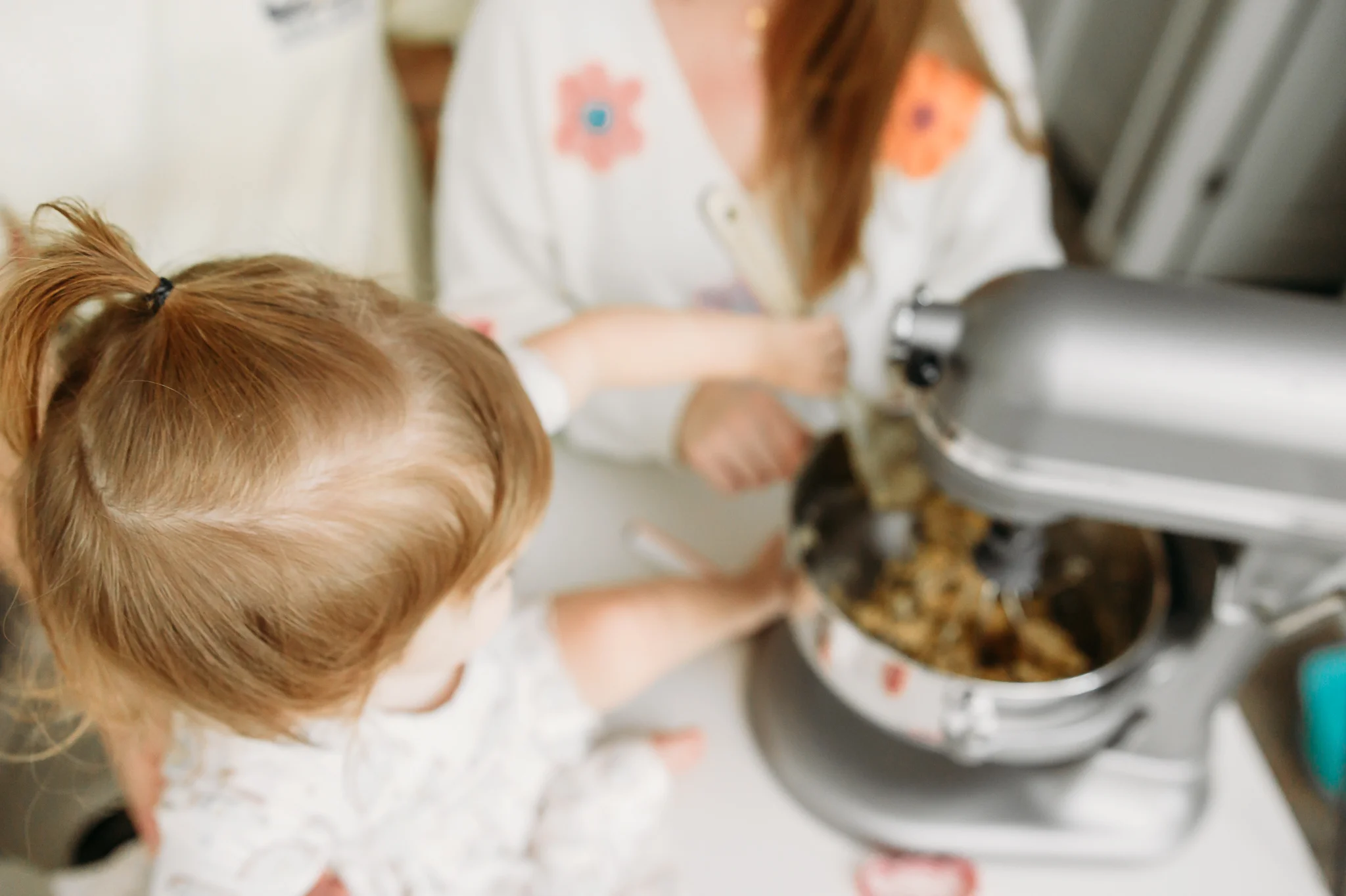 Family makes cookies together during at home photo session in OKC.