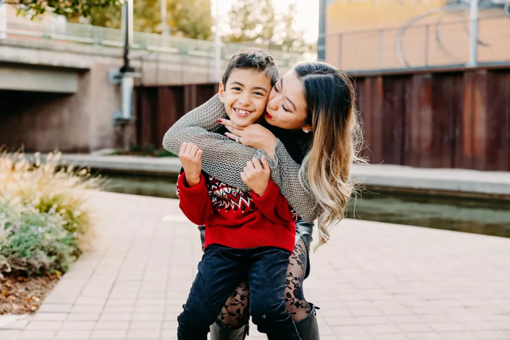Mom kisses son during photos in downtown OKC.