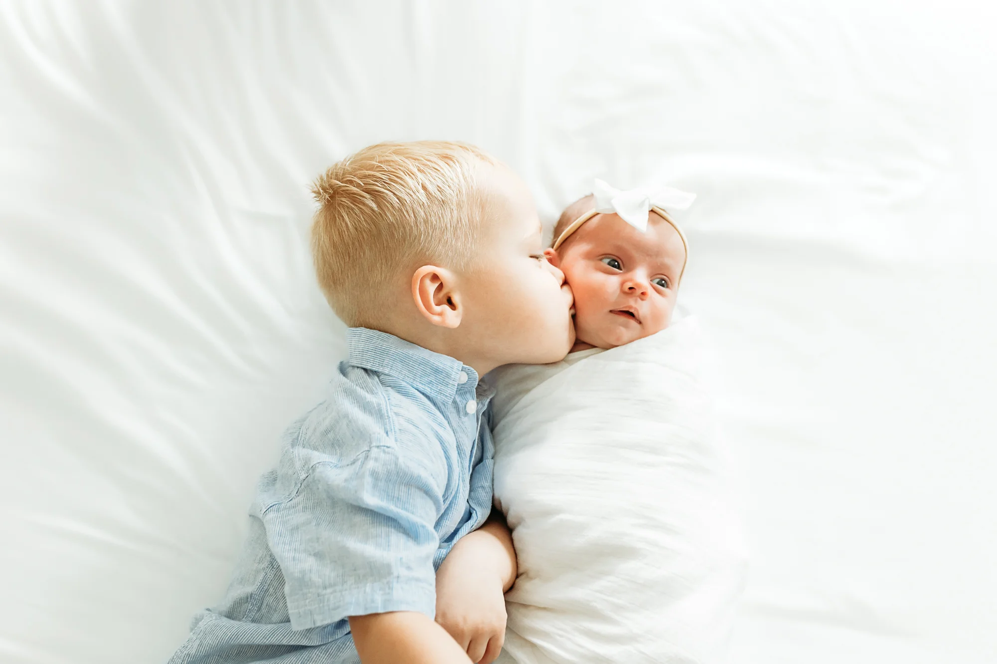 Couple with white poodle during newborn session in Oklahoma City