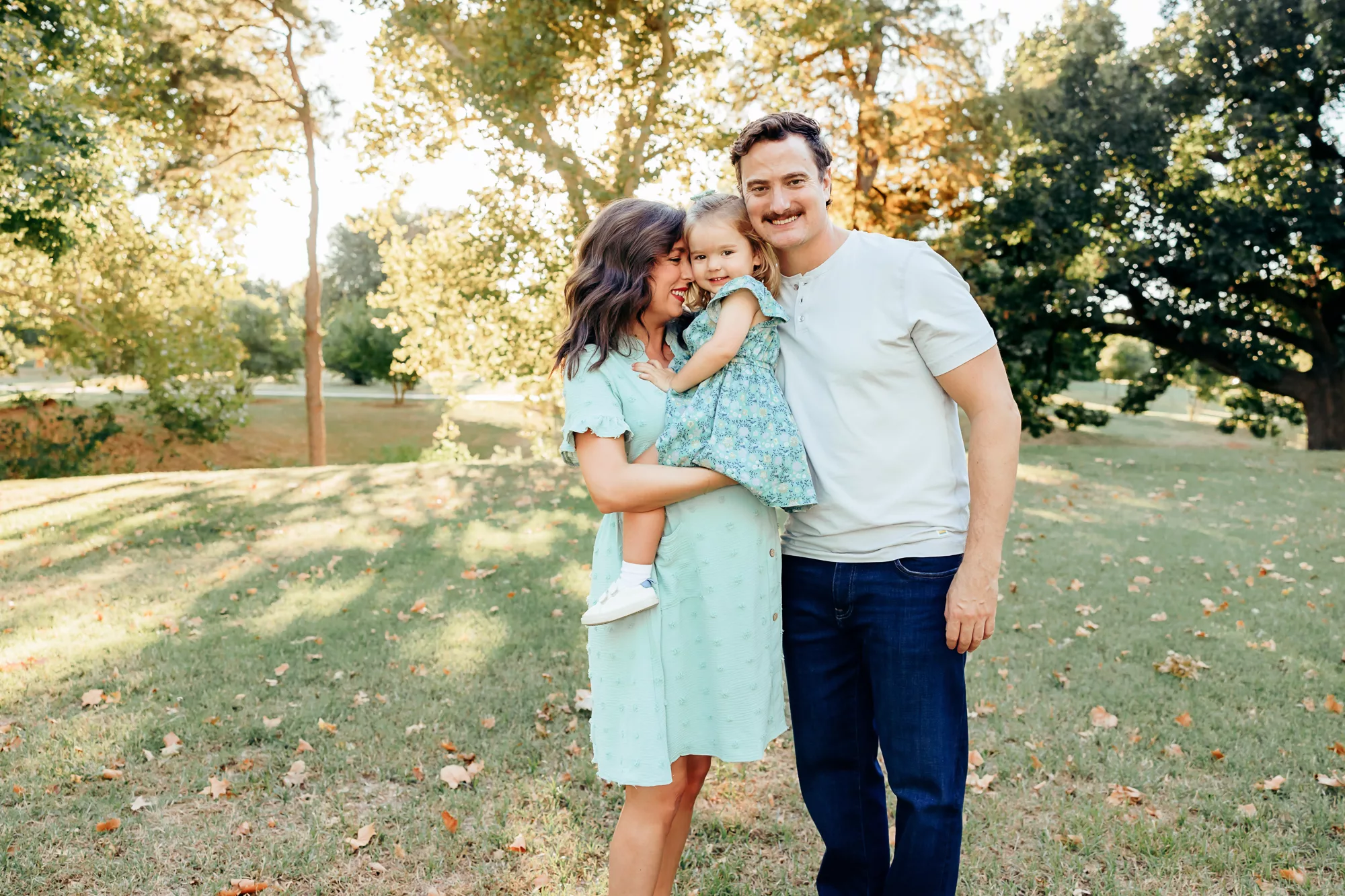 Family of 3 at will rogers botanical gardens during maternity photo session.