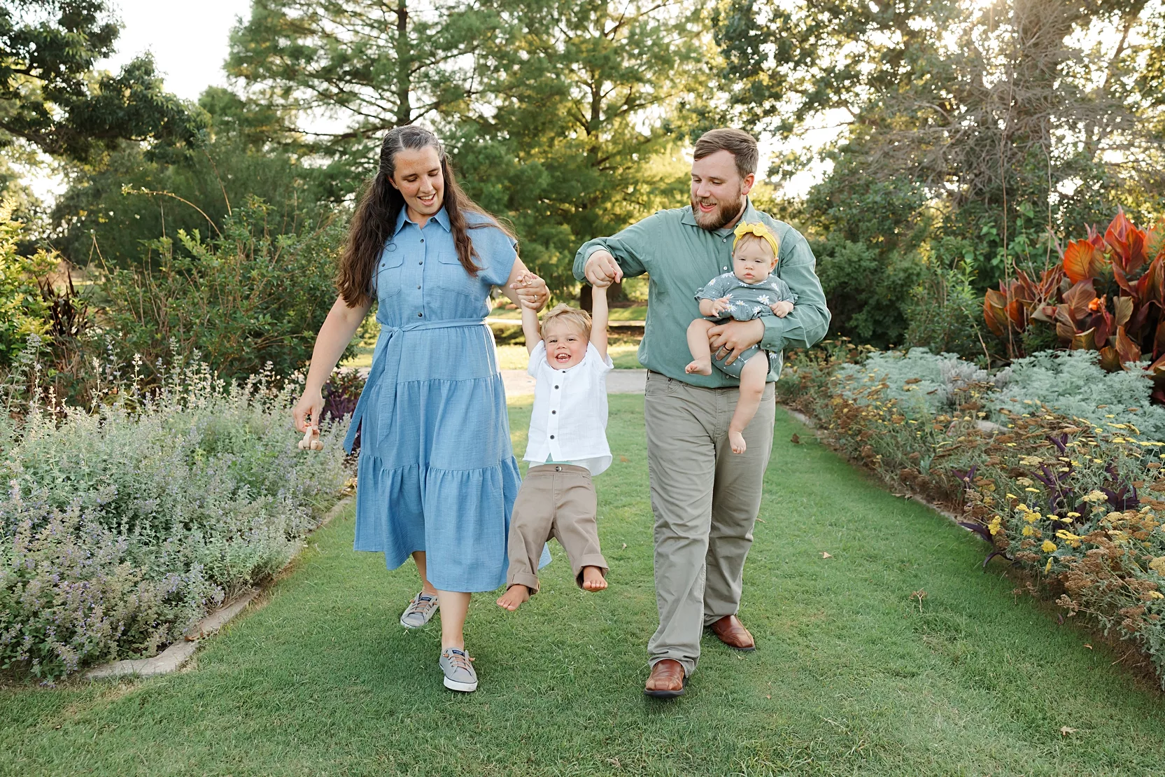Family of four plays together during their family photos at Will Rogers Gardens in Oklahoma City, OK.