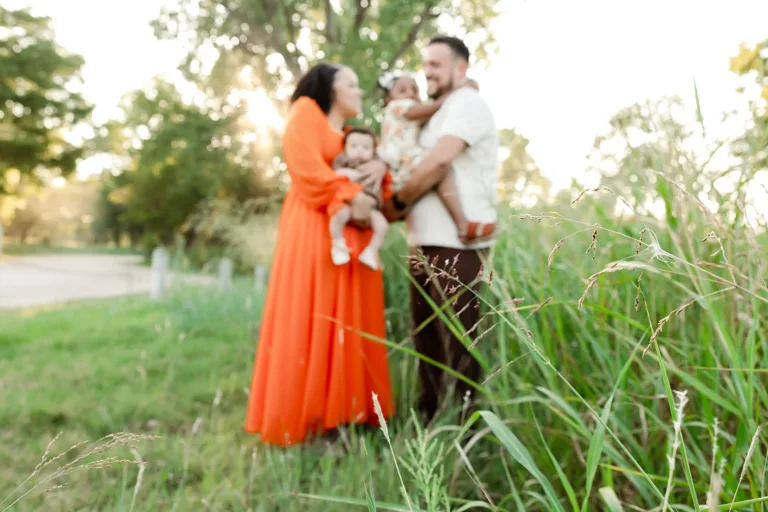 family in a field for photos sessions in okc in 2025 reflections.
