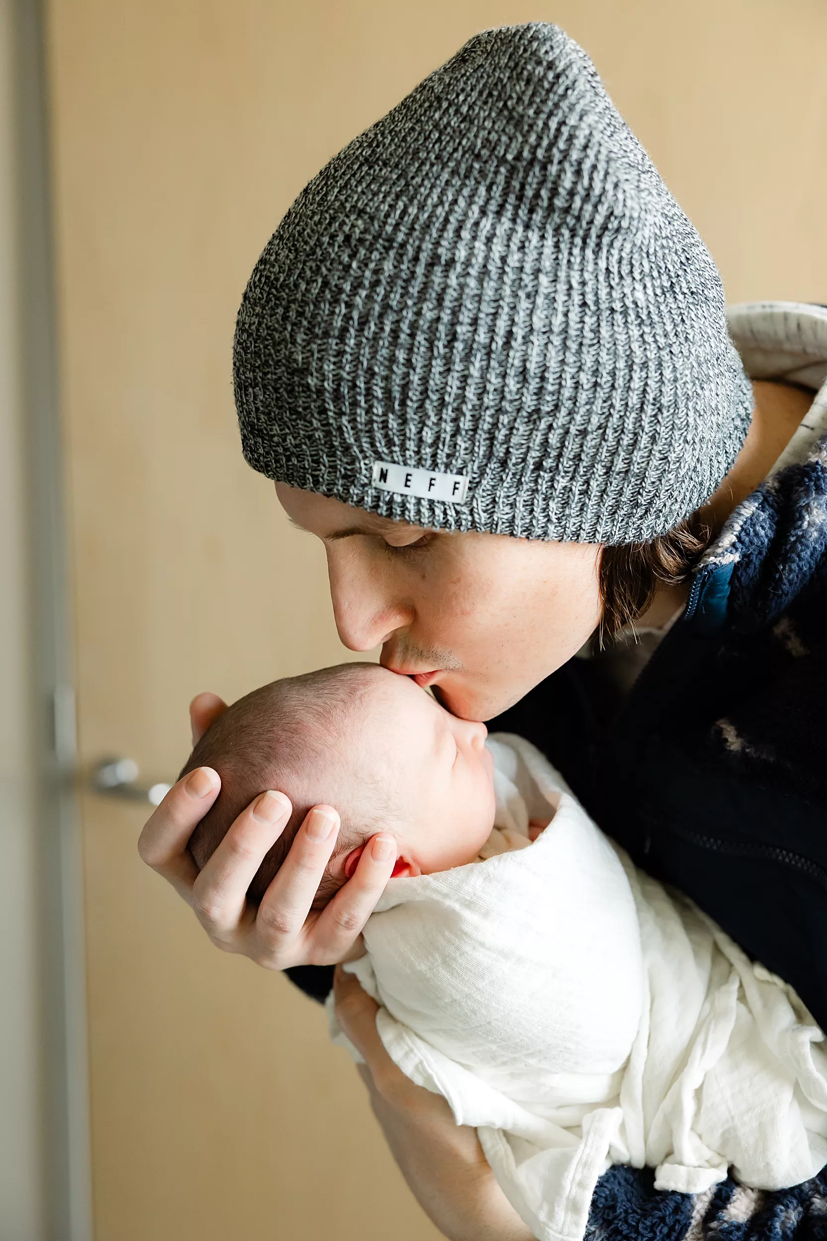 New baby lies in a hospital crib during a oklahoma city Fresh 48 photography session.