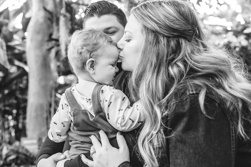 Family plays together at Myriad during a winter outing as a baby friendly activities for new parents with babies in OKC.