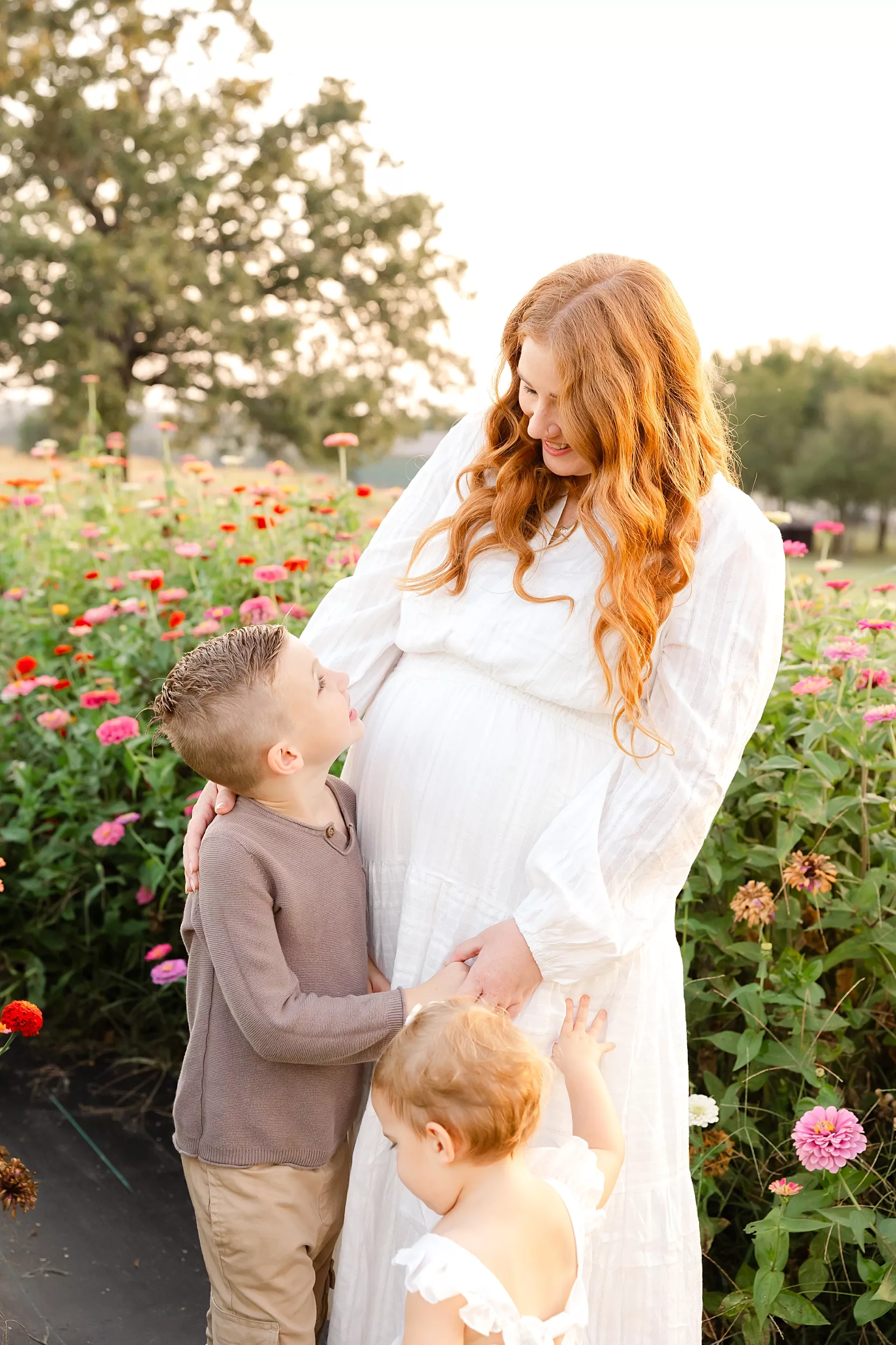 golden flower field family photos with mother and son.