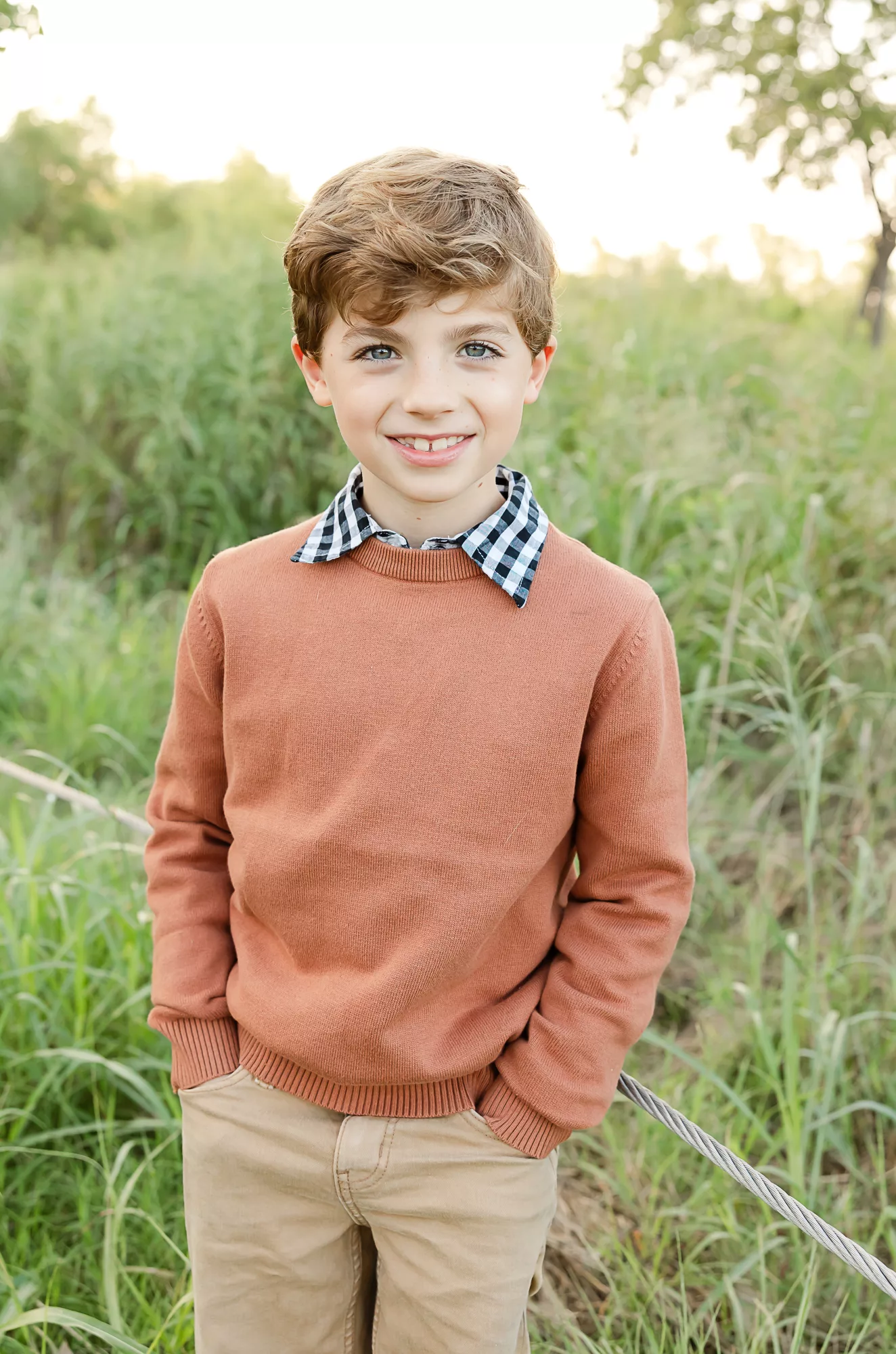 Boy in sweater for how to dress little boys for family photos in okc.