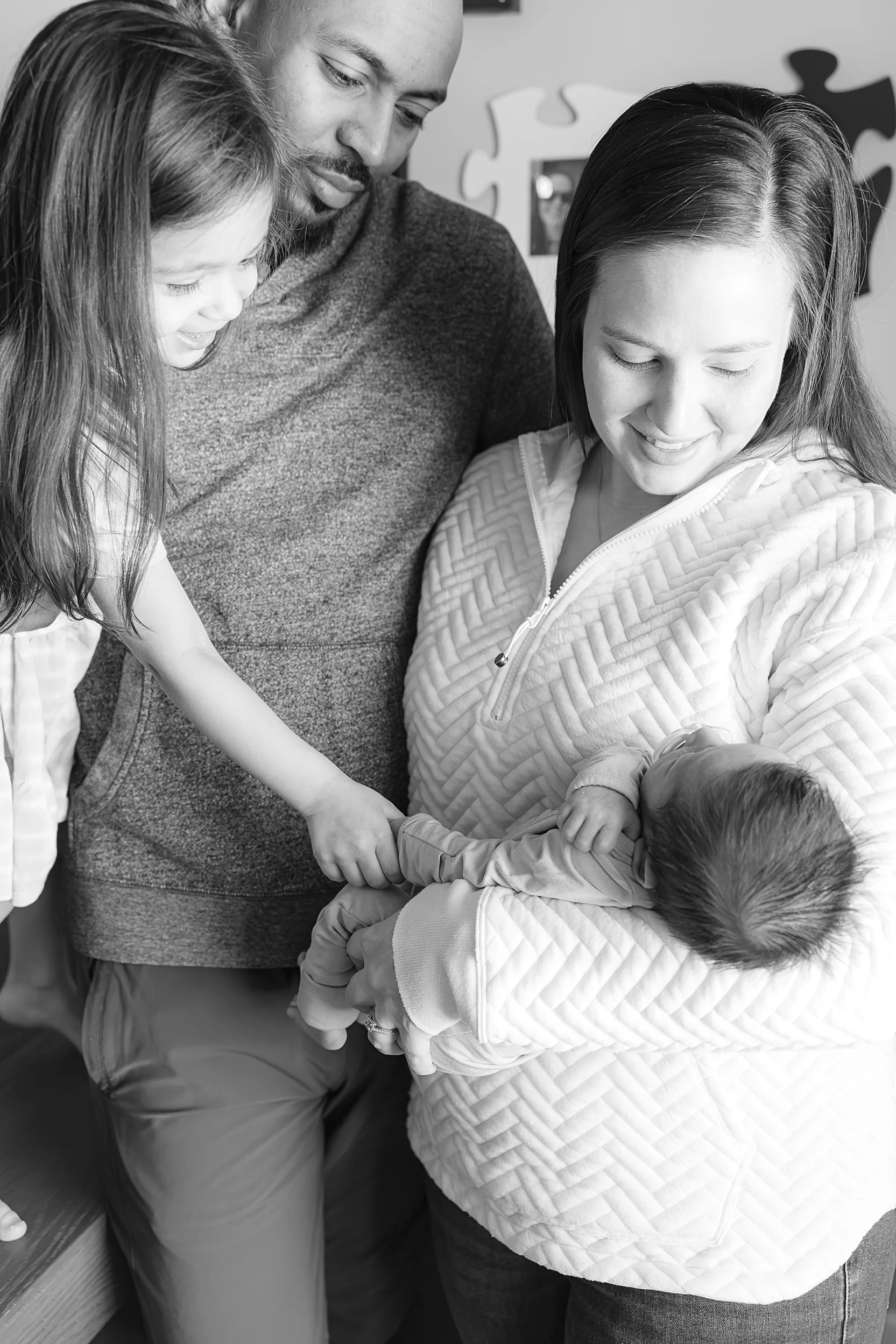 Dad kisses is son during an in hospital baby photo session.