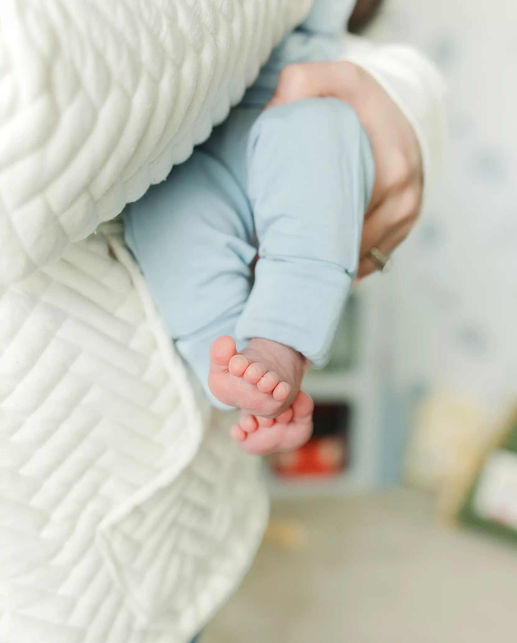 New baby lies in a hospital crib during a oklahoma city Fresh 48 photography session.