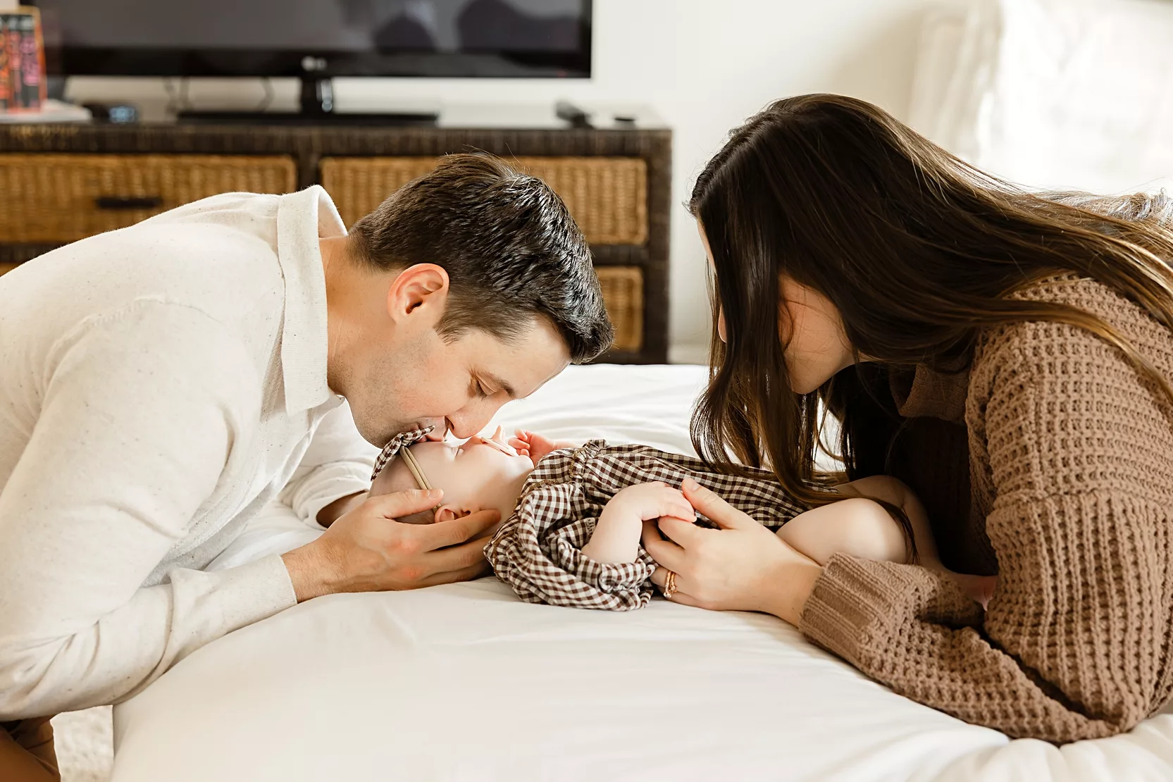 Mom and toddler read a book together during an at home family photo session in Oklahoma City.