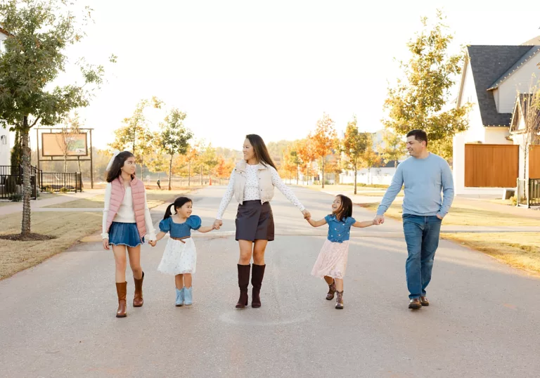 Family of 5 walks down the road in Selah a neighborhood in Norman, OK during their OKC family photo session.