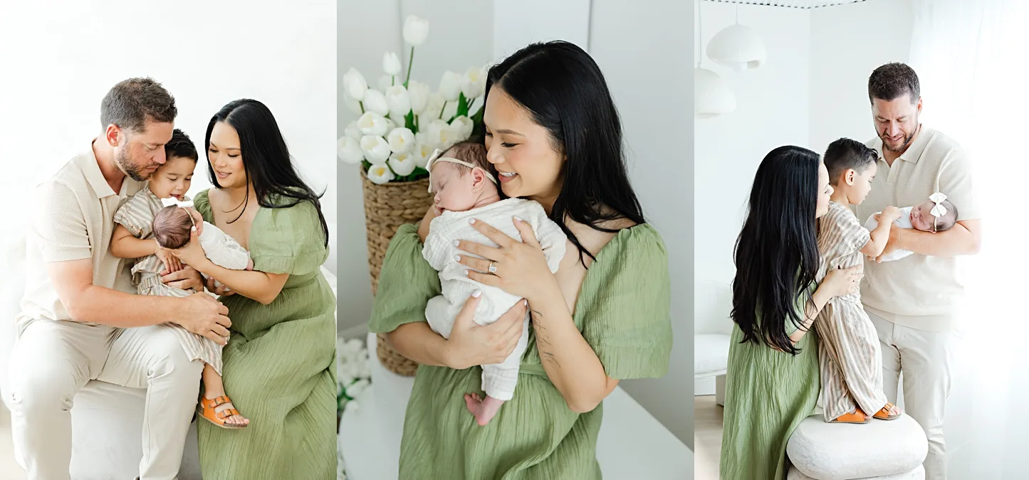 family of 3 plays on bed during in home family photo session