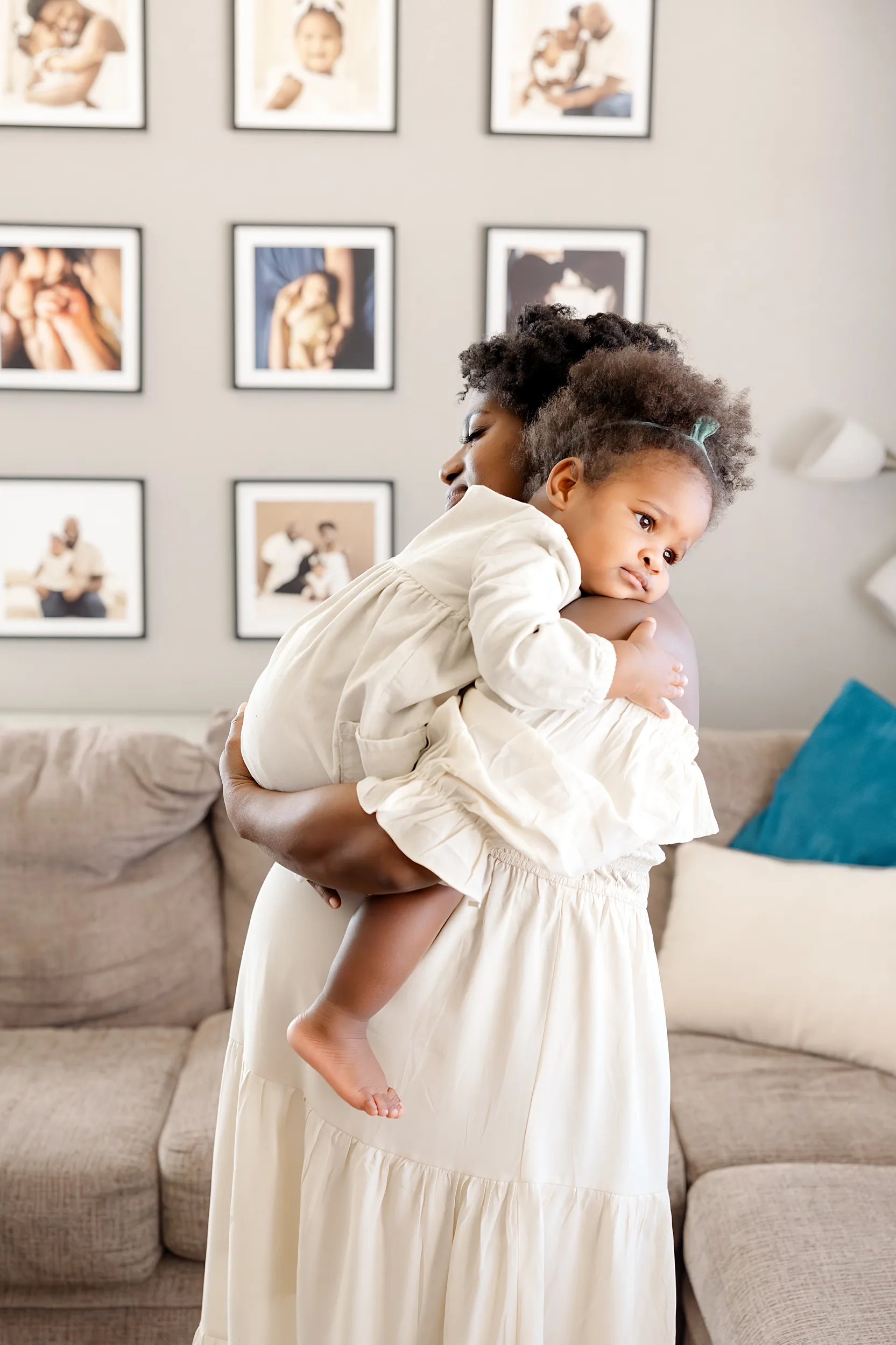 family of 4 during newborn photo session with overlay saying newborn on it.