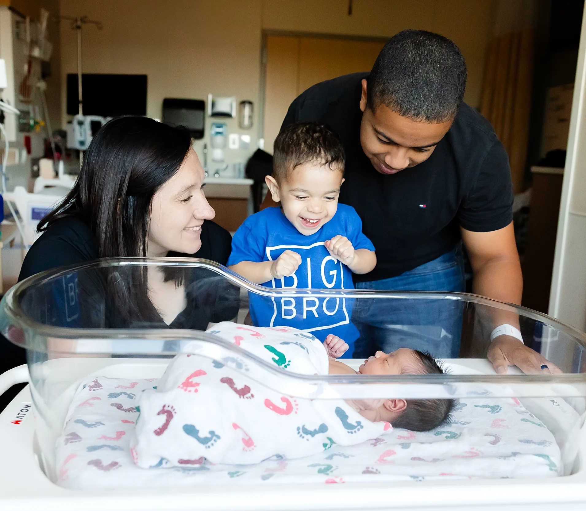 a little brother mets his baby brother for the first time.
