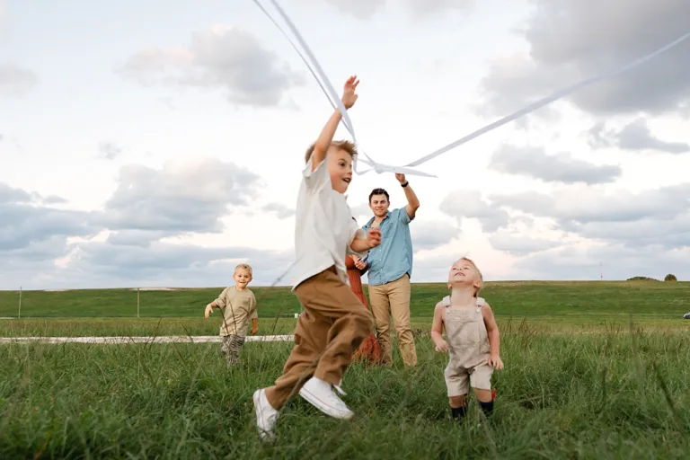 kids play with kites for a fun summer kid activities in OKC.