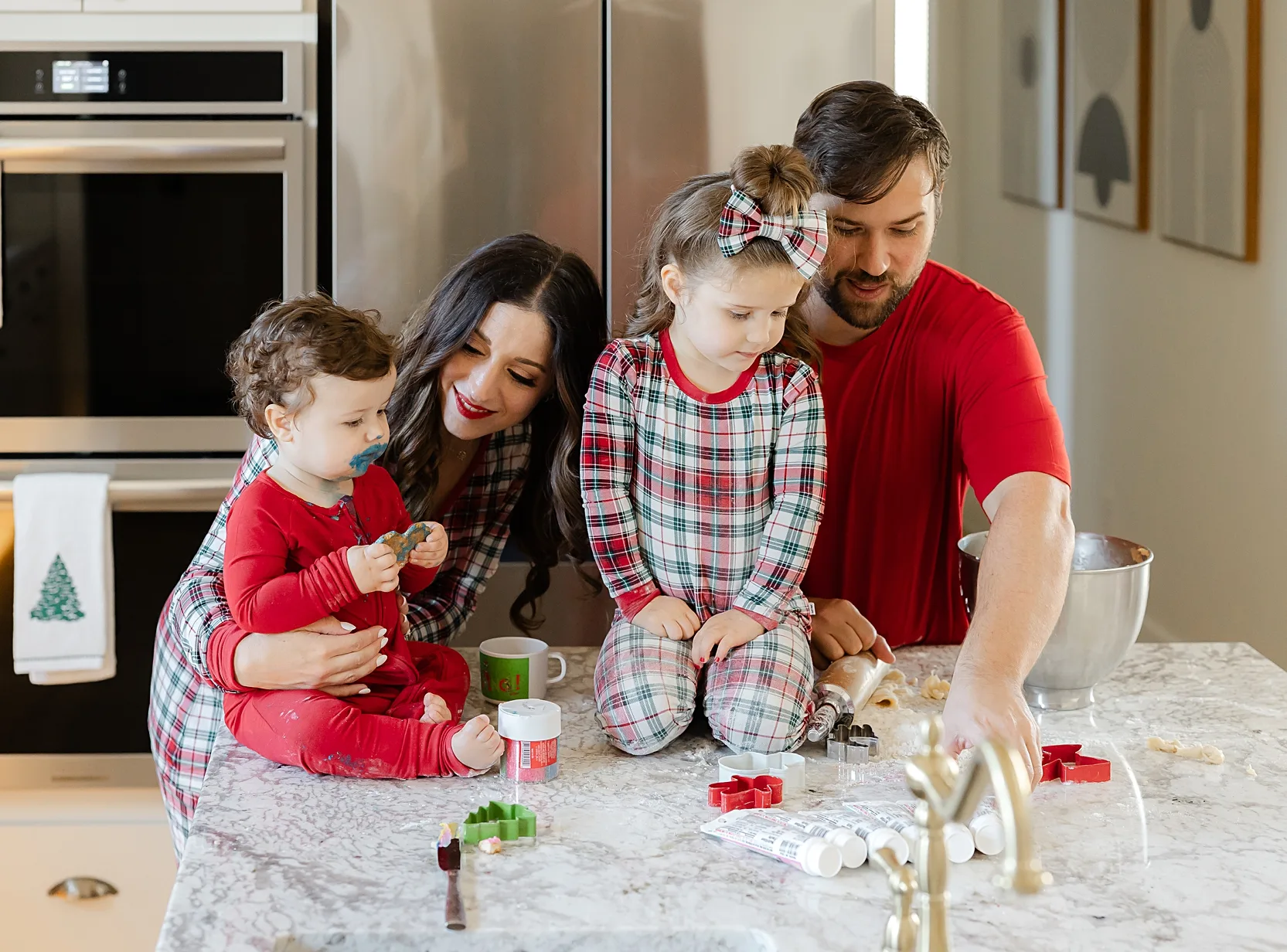 Family baking cookies for holiday photos at home in Oklahoma City.
